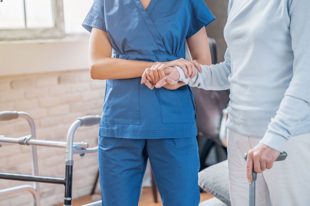 Report Reveals Poor Resident Care in Illinois Nursing Homes 1 Closeup of a nurse holds a senior at nursing home